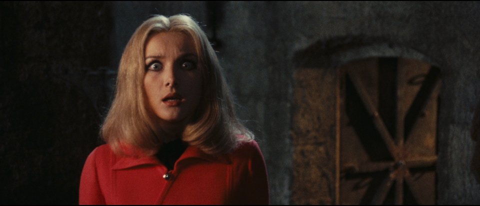 The Red Queen Kills Seven Times - Barbara Bouchet with eyes wide.